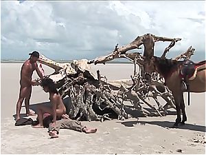 super-naughty mexican doll gets 2 meatpipes on the beach